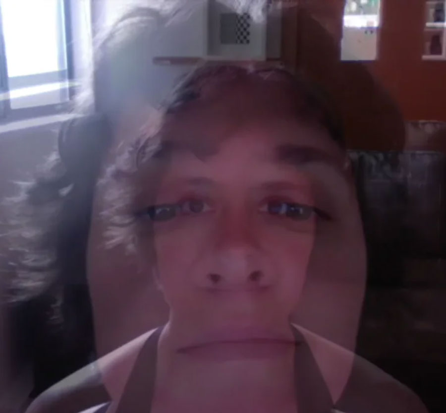 two different images, overlaid upon eachother, of my face looking up at a computer camera
