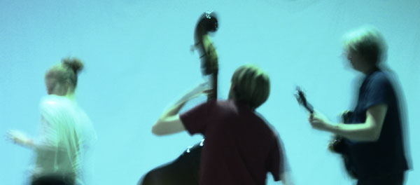 image of a dancer, upright bassist and guitarist